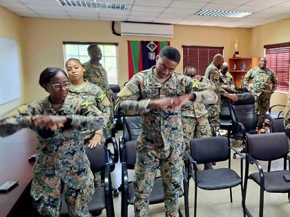 Members of the Jamaica Defence Force Health Services Corps participate in a psychological first aid training session conducted by a team of psychologists from Northern Caribbean University (NCU) at Up Park Camp in St Andrew on November 28. 2025. The initia