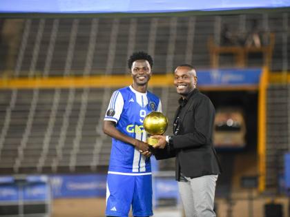 Mount Pleasant Football Academy club captain, Daniel Green, is awarded the Golden Ball after the Concacaf Caribbean Cup final against Universidad O&M at the National Stadium on December 2.