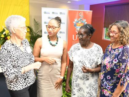 Professor Elsa Leo-Rhynie (left), former chair of the Dudley Grant Memorial Trust, has the captive attention of (from second left) Professor Zoyah Kinkead-Clark, Early Childhood Care and Education, The University of the West Indies (UWI); Alma Jean Panton,