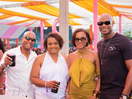 Sprint icon Asafa Powell (right) and his wife Alyshia (second right) share lens with Red Stripe Head of Commerce Sean Wallace (left) and Johnnie Walker Brand Manager Nadine Hylton.