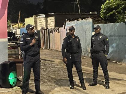 Divisional Commander for St Andrew South Police Division, Senior Superintendent Damion Manderson, along with members of his community safety and security team, at a street meeting at the corner of Water Street and Fitzgerald Avenue in St Andrew on December