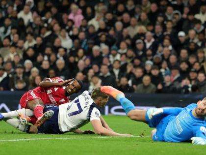 Liverpool’s Alexander Isak (left) grimaces as he picks up an injury in a challenge from Tottenham’s Micky van de Ven as he scores the opening goal during the English Premier League  match between Tottenham and Liverpool in London, Saturday, December 20