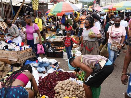 
In this 2021 photo people are seen shopping at the Grand Market in Linstead.
