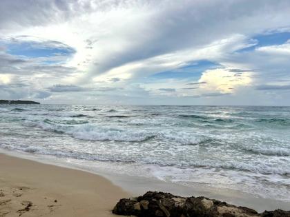 
A cloudy day at Long Bay Beach, Portland.