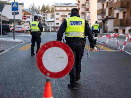 Police officers inspect the area where a fire broke out at the Le Constellation bar and lounge leaving people dead and injured, during New Year’s celebration, in Crans-Montana, Swiss Alps, Switzerland, Thursday, January 1, 2026. (Alessandro della Valle/K