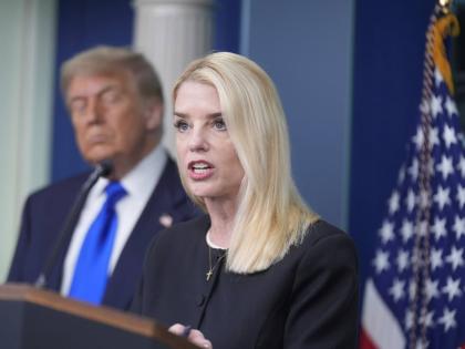 Attorney General Pam Bondi speaks to the media, Friday, June 27, 2025, in the briefing room of the White House in Washington, as President Trump looks on. (AP Photo/Manuel Ceneta)
