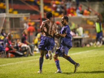 
Spanish Town Police FC teammates Diamond Clarke (left) and Devontay Ricketts celebrate the former’s goal against Waterhouse during a Jamaica Premier League match at the Anthony Spaulding Sports Complex on December 15, 2025. 