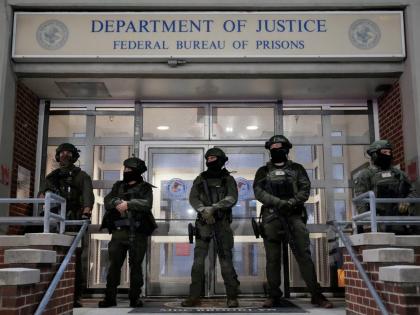 Federal law enforcement personnel stand watch outside the Metropolitan Detention Center as they await the arrival of captured Venezuelan President Nicolás Maduro in New York. 