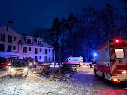 Emergency vehicles from the aid organisation “Die Johanniter” pick up residents of a retirement home in Berlin, during a power cut after a fire on a cable bridge. 
