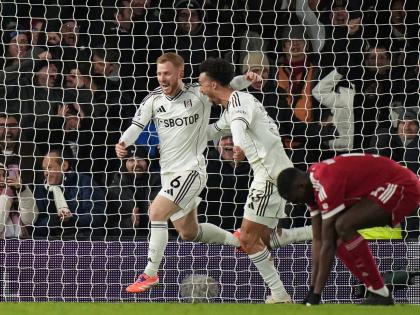 Fulham’s Harrison Reed (left) celebrates after scoring his side’s second goal during the English Premier League match between Fulham and Liverpool in London yesterday.