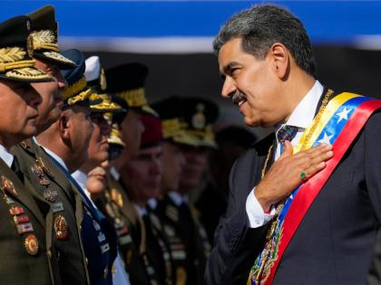 Venezuela's President Nicolas Maduro places his hand over his heart while talking to high-ranking officers during a military ceremony on his inauguration day for a third term, in Caracas, Venezuela on January 10, 2025. The US captured him in Venezuela on J