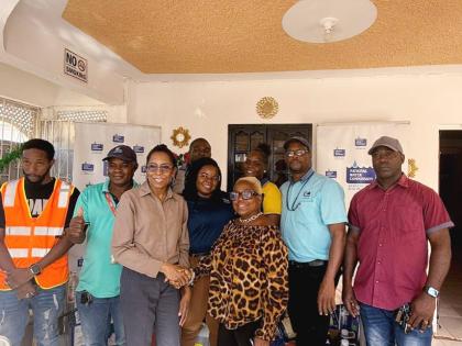 Representatives of the National Water Commission’s maintenance team (eastern) along with Acting Community Relations Manager (eastern) Ann Bolt (third from left), during the handover of donated items to Sandy Frazer-Jackson, manager of the Ultimate Care C