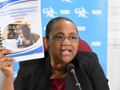 Caribbean Examinations Council (CXC) Director of Operations, Dr Nicole Manning, displays a copy of the School-Based Assessment (SBA) Concession document during a CXC press conference held at the Overseas Examinations Commission (OEC) in St Andrew on Januar