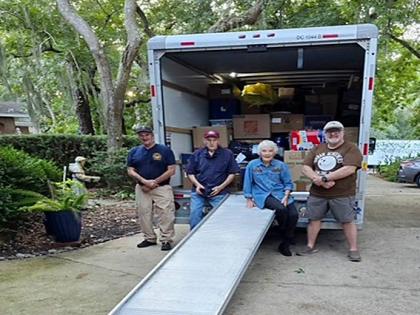 A truck is being loaded in Florida to be shipped to Jamaica with the help of Dame Linda Keller and volunteers. 
