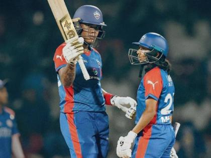 Chinelle Henry (left) celebrates after reaching her half-century for the Delhi Capitals Women during a Women’s Premier League encounter against the Mumbai Indians in Mumbai yesterday. 