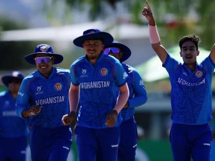 Afghanistan U19 players celebrate victory over the West Indies during an ICC U19 World Cup game at the High Performance Oval in Windhoek, Namibia yesterday.