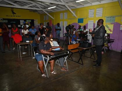  Chief Executive Officer (CEO) of the St Thomas Municipal Corporation, Kevin McIndoe (left), speaks with Councillor Andrea Patience of the Llandewey Division (centre) and Director of Planning at the St Thomas Municipal Corporation, Shavar Ellis, during a t