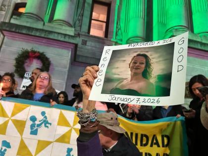 People gather in Philadelphia at an anti-immigration enforcement rally and vigil for Renee Good, who was shot and killed by an Immigration and Customs Enforcement officer in Minnesota. 