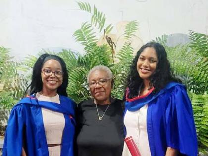 Joan Crooks (centre) celebrates with her granddaughters Ana‑Paige Henry (left) and Marianna Crooks (right), who both graduated from The University of the West Indies, Mona. 