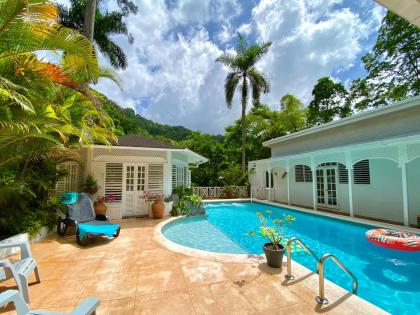 As incredible as it may seem, this house exists in a deep river valley at the base of the Blue Mountains.