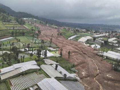 In this photo released by the Indonesian National Search and Rescue Agency, an aerial shot taken using a drone shows an area affected by landslides in Pasir Langu village, in West Bandung district of West Java province, Indonesia.