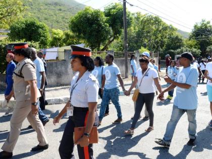 In this 2017 photo members of the Jamaica Constabulary Force are seen participating in a peace march.