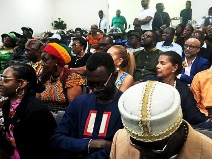 Attendees at a Ghana Association in Jamaica town‑hall meeting at the Somerset Suite of Courtleigh Hotel and Suites in New Kingston on Saturday. 