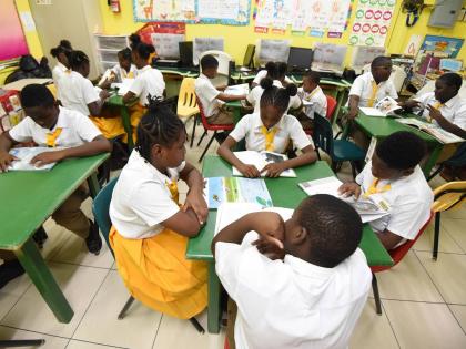 This October 2025 shows students of McCauley Primary school in Spanish Town, St Catherine reading in the school library.