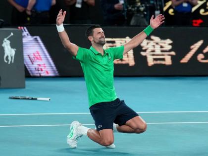 Novak Djokovic of Serbia celebrates after defeating Jannik Sinner of Italy in their semifinal match at the Australian Open tennis championship in Melbourne, Australia, early Saturday, January 31, 2026.