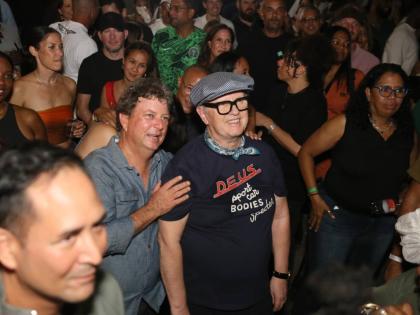 Jason Henzell (left) of Jakes Hotel and British-born disc jockey David Rodigan soaking up the high energy of Dubwise: Many Rivers to Cross held on West Kings House Road in St Andrew on January 23.