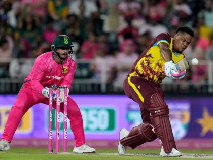 
West Indies batsman Shimron Hetmyer (right) plays a shot as South Africa’s wicketkeeper Quinton de Kock watches on during the final T20 International in Johannesburg, South Africa, yesterday. The West Indies won by six runs.