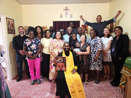 Father Marlon Myers poses for a photo with some of the congregants. 
