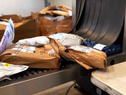 Incoming packages undergo routine scanning by Jamaica Customs at a warehouse in Kingston.