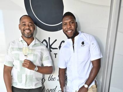 Co-founders of Broken Plate, Kwasi Henry (left) and Chef Damion Stewart, keep it cool and simple as they pause their confab for a quick snap.