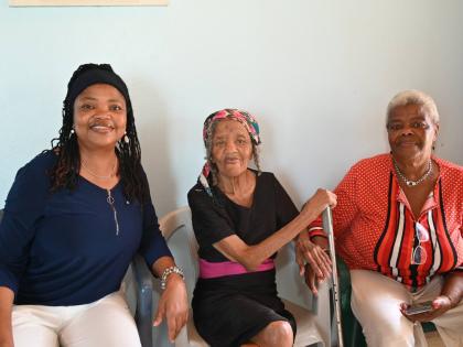 Vera Brown (centre), 105 years old, at home with her daughters Winsome Brown (left) and Joy Lindsay in Cambridge, St James.