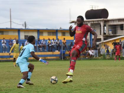 Montego Bay United’s Jourdain Fletcher (right) is challenged by Treasure Beach F.C’s goalkeeper Mowey Morgan (left) during their Jamaica Premier League game at St. Elizabeth Technical High (STETHS) Sports Complex on Sunday, January 4, 2026.