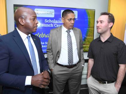 From left: Pearnel Charles Jr, minister of labour and social Security; Donovan Williams, state minister in the Ministry of Labour and Social Security; and Benjamin Murray, communications adviser at Ontario Fruit and Vegetable Growers’ Association; in dia