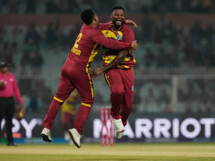 West Indies’ Romario Shepherd (right) celebrates the wicket of Scotland’s Safyaan Sharif with Shimron Hetmyer during their opening T20 World Cup cricket in Kolkata, India, yesterday.