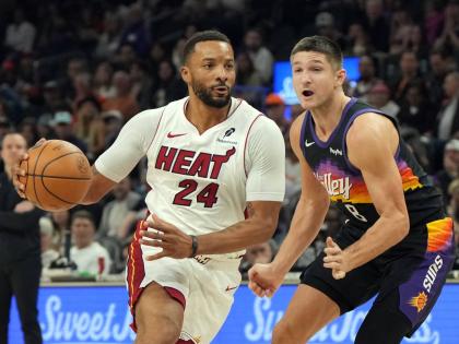 AP 
Miami Heat guard Norman Powell (24) drives past Phoenix Suns guard Grayson Allen (8) during the first half of an NBA basketball game on Sunday, January 25.