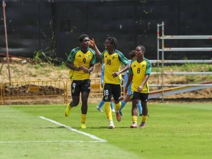 From left: Jamaica Under-17’s Kelvin D Brown celebrates scoring a goal against Aruba with teammates Jude Royes and Jaheem Bennett during their Concacaf U17 Qualifier at the Costa Rica Football Federation field on February 6. Jamaica’s Under-17s became 