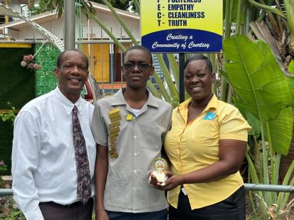 From left: Arnaldo Allen, principal of New Forest High School; Dontae Daley, grade-nine student, and Dontae’s mom Tricia Carter.