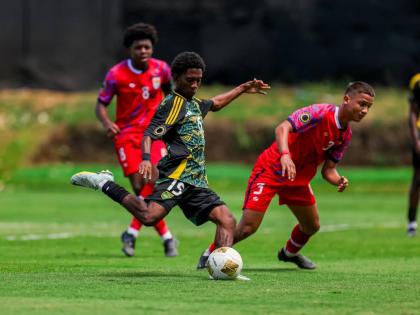 Jamaica’s Rajon McKenzie gets ready to kick a ball during a Concacaf Under-17 Qualifier against the Cayman Islands on Sunday. McKenzie scored during the 12-0 win for the Jamaicans.