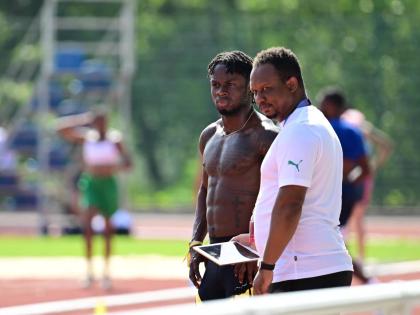 Ackeem Blake (left) and  his coach Michael Frater.
