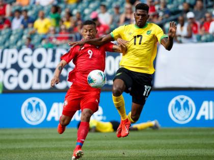 Jamaica’s Damion Lowe (right). 