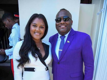 Senator Abka Fitz-Henley dons a purple suit from Spokes Apparel as he pauses for a snap with Nicole Ebanks, advisor in the Ministry of Economic Growth and Job Creation. Ebanks is wearing a black and white tuxedo dress from Ignite Boutique. 