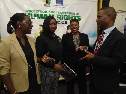 Jamaicans for Justice Executive Director Mickel Jackson (second left) discusses the findings of the Citizens’ Rights. Roles, Responsibilities and Practice Survey 2025 with (from left) Vanna Lawrence, programme manager, Delegation of the European Union to