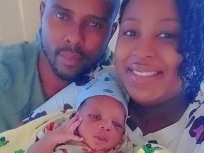 First-time parents, Natasha McKenzie Petgrave and her husband, Jovain Petgrave, cradling their baby boy, who was born on New Year’s Day.