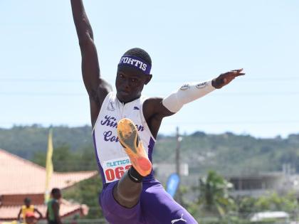 Alexander Pusey of Kingston College wins the Class Two boys’ long jump with a leap of 7.05 metres on day one of the Corporate Area Athletics Championships at Ashenheim Stadium, Jamaica College, yesterday.