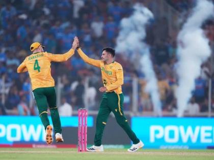 South Africa’s Keshav Maharaj (right) celebrates with captain Aiden Markram the wicket of India’s Arshdeep Singh during the T20 World Cup cricket match between India and South Africa in Ahmedabad, India, yesterday.