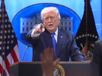 President Donald Trump points to a reporter during a press briefing at the White House, Friday, February 20, 2026, in Washington. (AP Photo/Evan Vucci)
